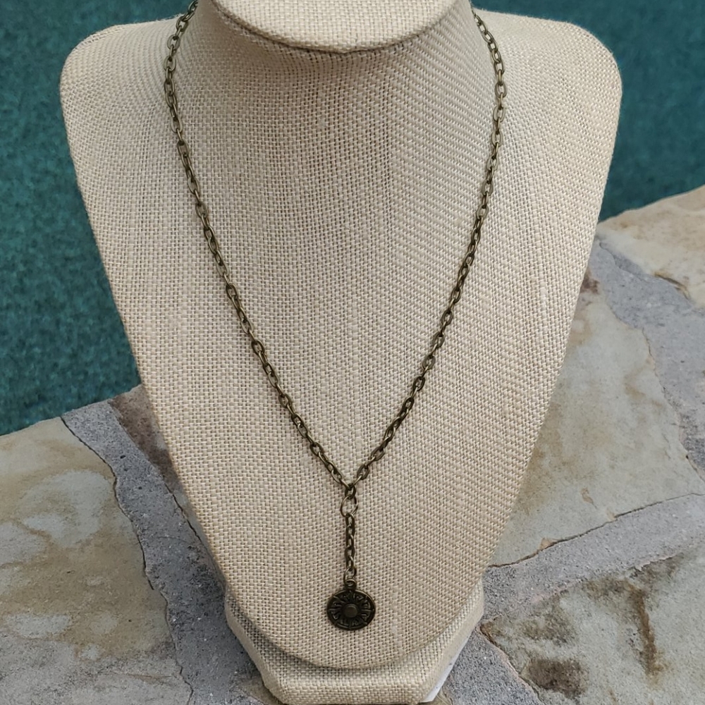 Bronze plated necklace with Sunburst charm.